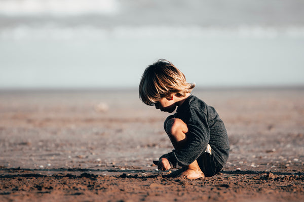 Young girl playing in the dirt