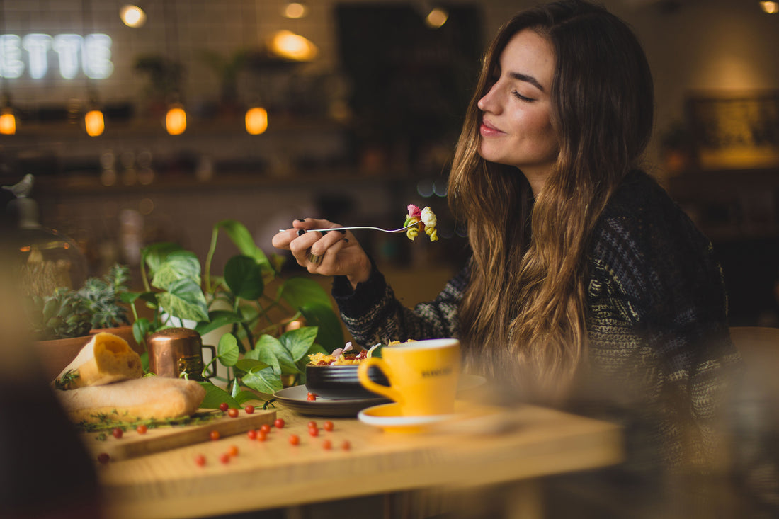 woman eating a bowl of chicken soup